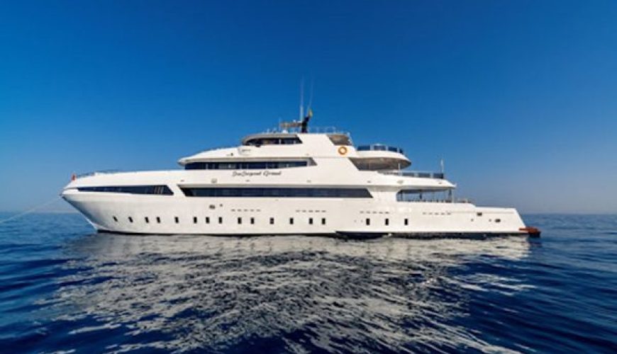 Liveaboard boat anchored near Daedalus Lighthouse, showcasing the three top liveaboard routes for diving the Deep South from Marsa Alam.